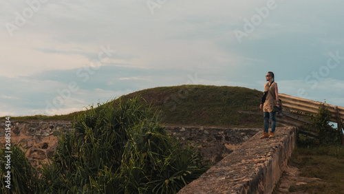Traveller walking on a castle wall in Galle, Sri Lanka