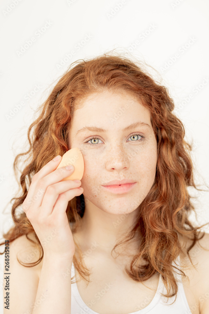 Washing face with sponge Washing face with sponge