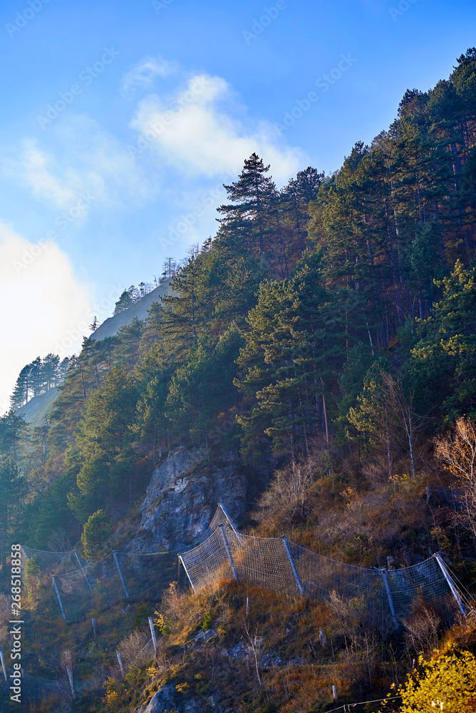 Mountain landscape with forest and blue sky in Austrian Alps. Salzkammergut region Mountain landscape with forest and blue sky in Austrian Alps. Salzkammergut region