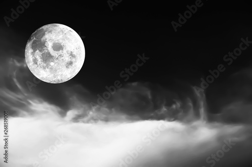 Fototapeta Naklejka Na Ścianę i Meble -  Dramatic atmosphere panorama view of black and white soft cloud and full moon image on night background. Image of moon furnished by NASA.