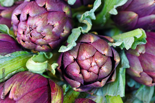 Purple artichokes (carciofi) at an Italian farmers market photo