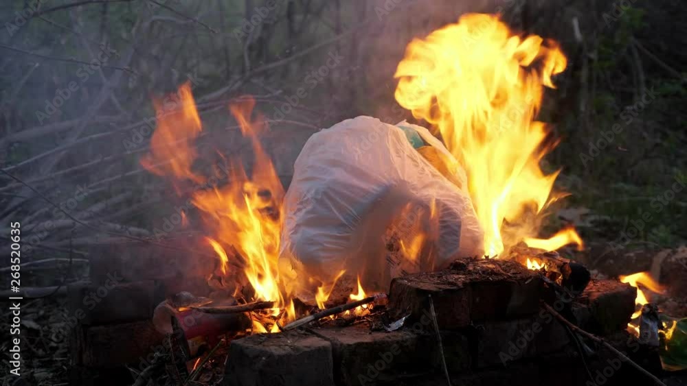 flame fire and smoke burning garbage waste of plastic to air pollution. flame fire and smoke burning garbage waste of plastic to air pollution.