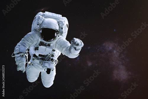 Fototapeta Naklejka Na Ścianę i Meble -  Astronaut in outer space. Science fiction wallpaper. Elements of this image were furnished by NASA.