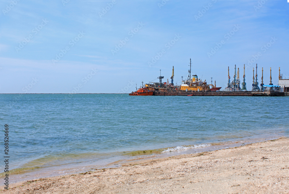 Sea port view. Ships at the pier of Azov Sea, Ukraine, seascape, nature background, copy space.