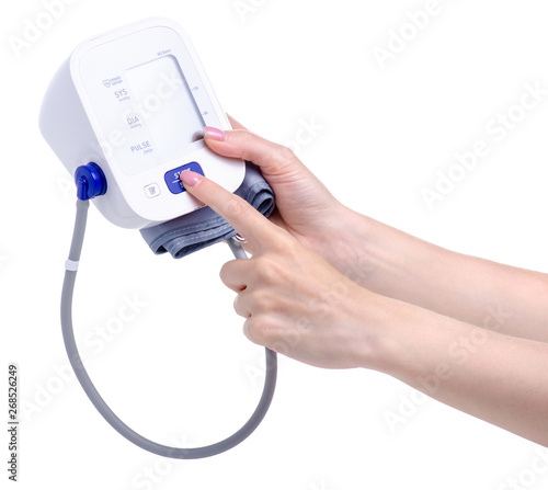 Digital blood pressure monitor electric tonometer in hand on white background isolation