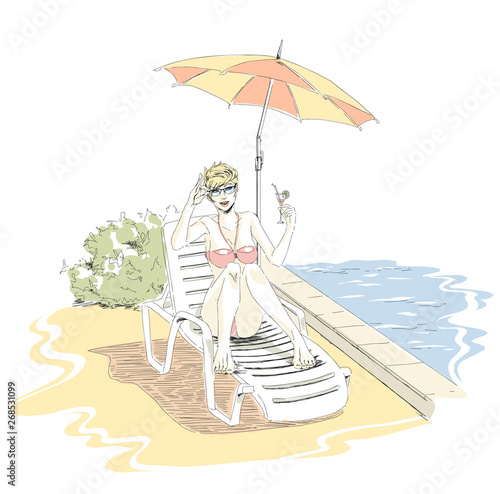 Beautiful elegant girl is relaxing on  chaise lounge on beach and drinking cocktail