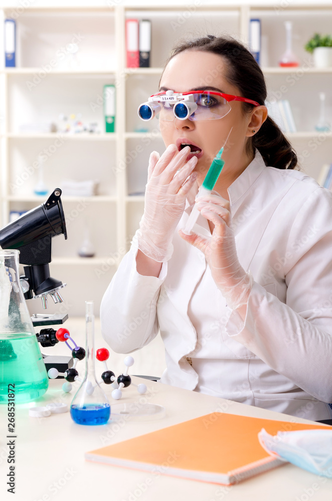 Young female chemist working in the lab Young female chemist working in the lab