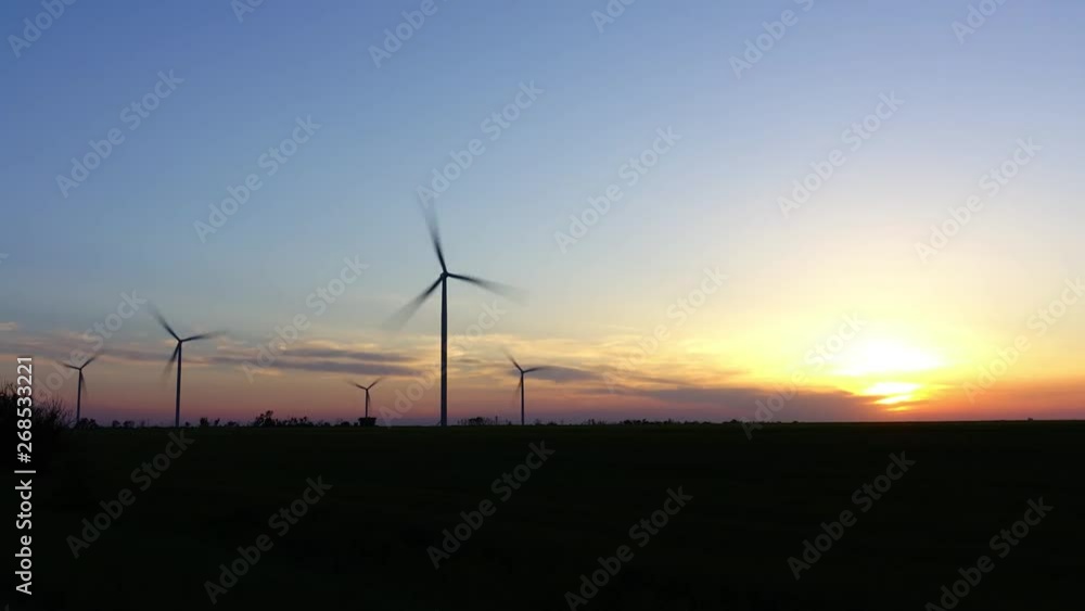 Windmill. Wind farm. Wind turbine. Shooting of Time lapse. Shooting at a sunset. Windmill. Wind farm. Wind turbine. Shooting of Time lapse. Shooting at a sunset.