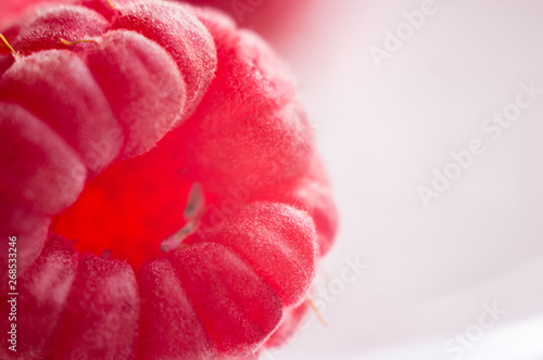 raspberries on a white saucer close up, macro photo