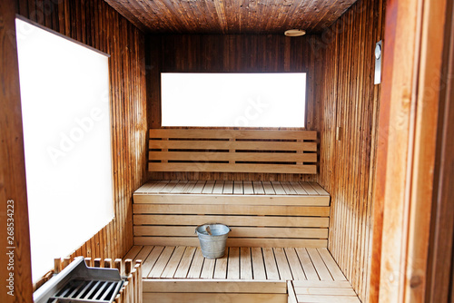 sauna with benches and bucket