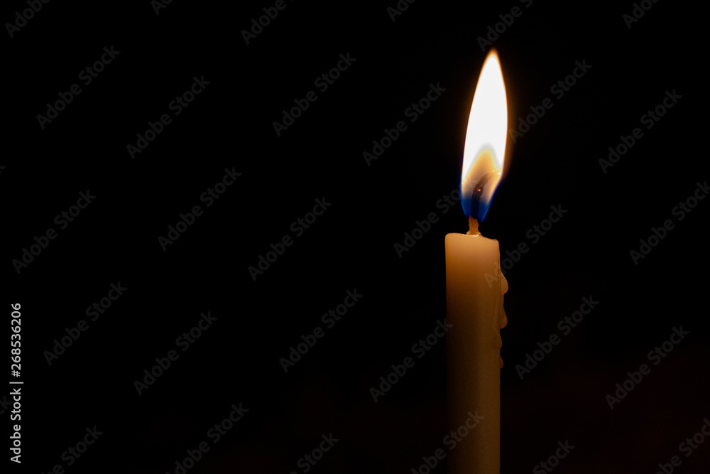 Candle light in the dark. Abstract of creative light and hope on dark background Candle light in the dark. Abstract of creative light and hope on dark background