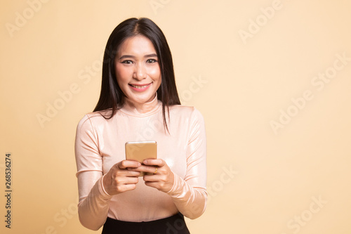 Young Asian woman with mobile phone.