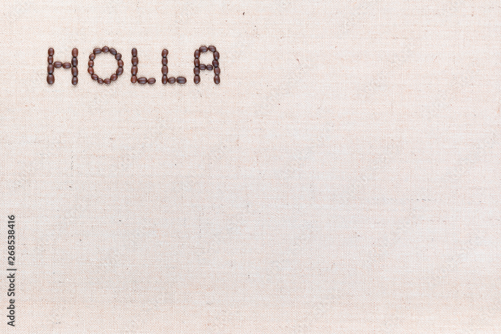 The word Holla written with coffee beans shot from above, aligned at the top left.