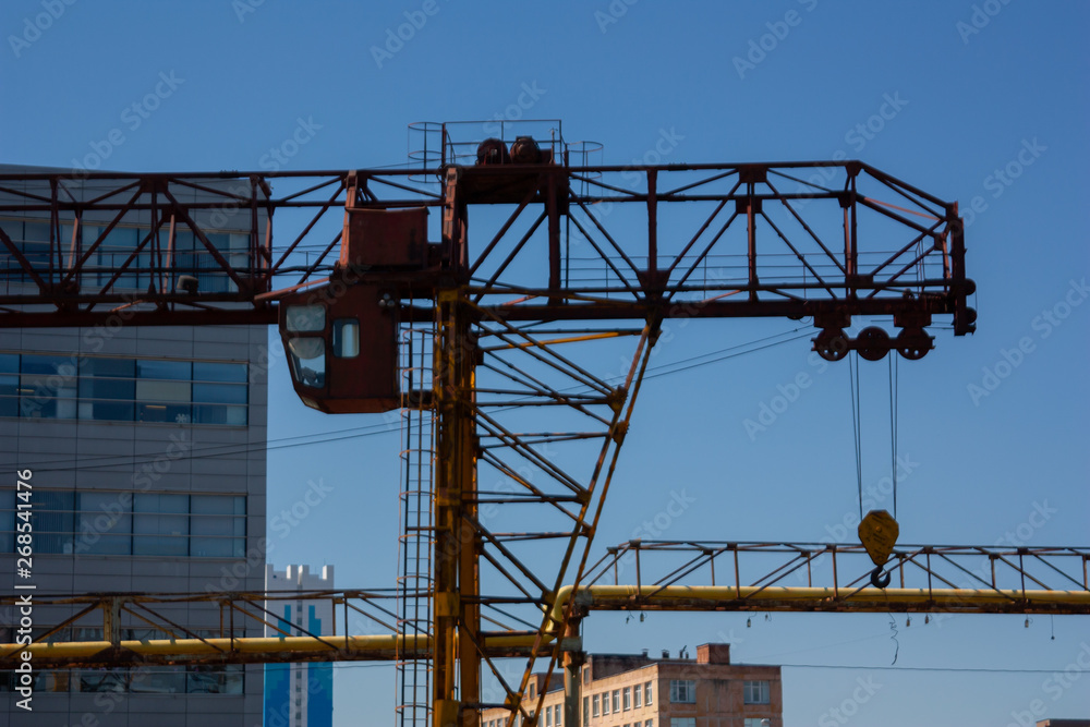 Old rusty overhead crane. Industrial construction Old rusty overhead crane. Industrial construction