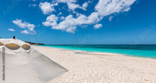 White umbrella on beautiful Shoal Bay beach in Anguilla. 