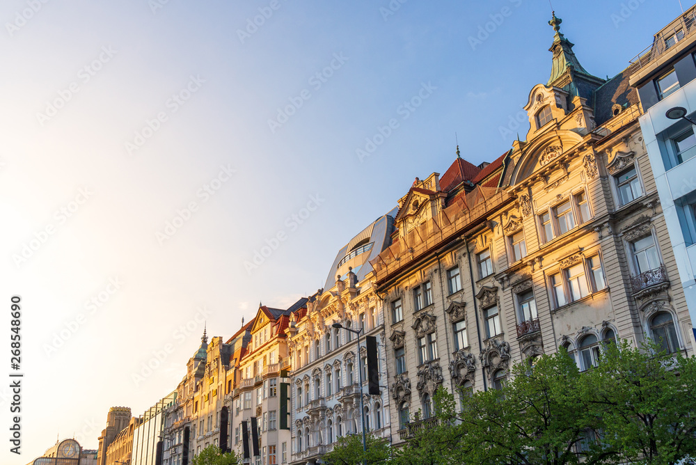 Outdoor sunny view of beautiful exterior Art Nouveau facade of buildings around Wenceslas Square in Prague, Czech Republic.