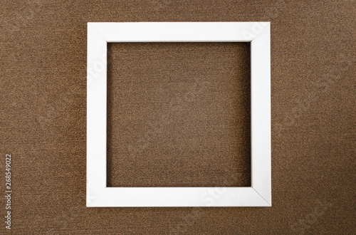 White square frame on brown mother-of-pearl designer cardboard.