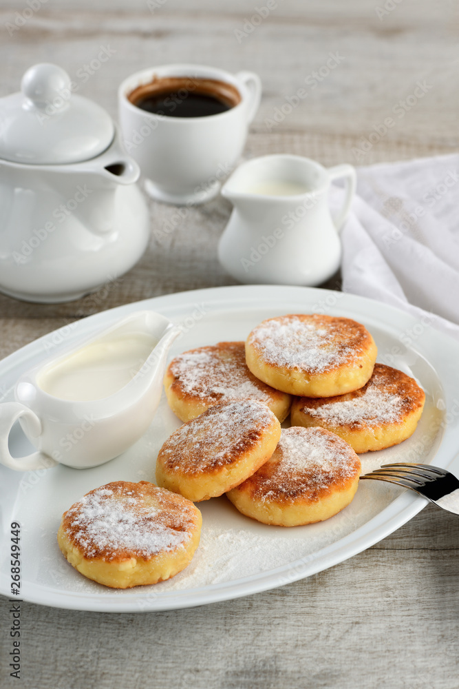 Breakfast. Cheese pancakes with sour cream Breakfast. Cheese pancakes with sour cream