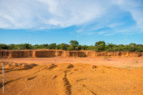 Dry, orange soil and blue sky in the countryside of Oeiras - Piaui state, Brazil (Sertao landscape)