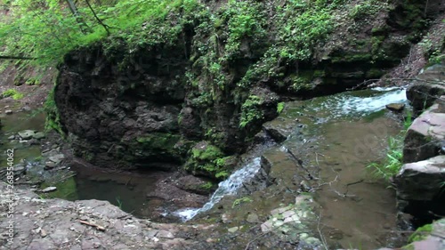 view of Rusyliv Falls is located on the Rusyliv river (right tributary of the Strypa River), Ternopil region of western Ukraine photo