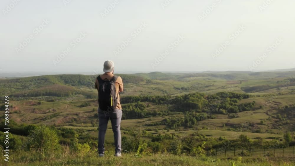 Traveler is viewing the beautiful green valley Apuseni mountains. Traveler is viewing the beautiful green valley Apuseni mountains.
