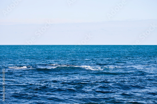 Waving water surface of the Adriatic sea and sky.