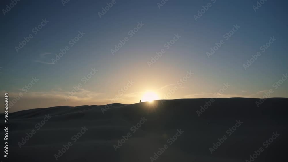 Beautiful Cinematic Sunrise over Dune in Desert With Distant Silhouette of Person Walking on Top Of Sand Hill in Stockton Worimi Aboriginal National and Regional Park Australia 4k Beautiful Cinematic Sunrise over Dune in Desert With Distant Silhouette of Person Walking on Top Of Sand Hill in Stockton Worimi Aboriginal National and Regional Park Australia 4k