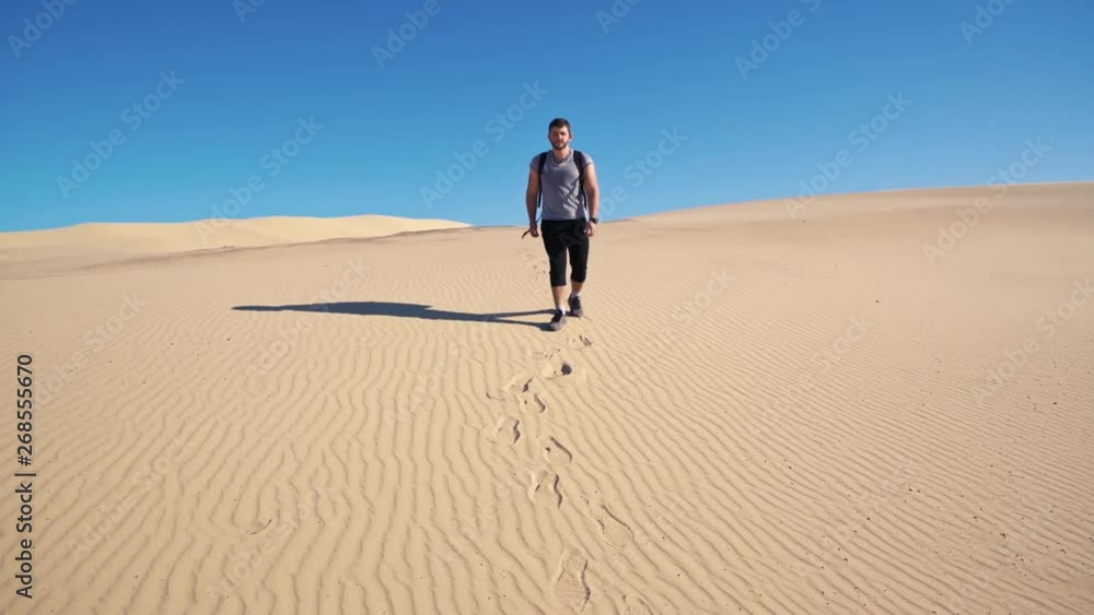 Male Tourist With Backpack Walking on Footsteps in Sand on Desert Dune in Stockton Worimi National Park Australia 4k Male Tourist With Backpack Walking on Footsteps in Sand on Desert Dune in Stockton Worimi National Park Australia 4k