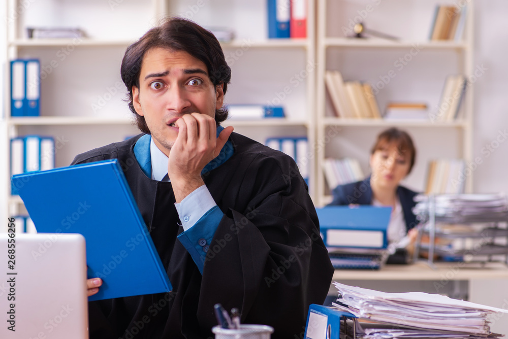 Two lawyers working in the office Two lawyers working in the office