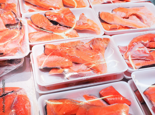 Fresh salmon fillet in packing for sell in supermarket or seafood market. Healthy food (salmon/ fish/ seafood)