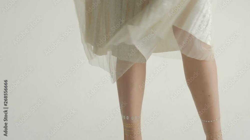 Happy young woman dance in light dress, turn around to express positive emotions. Light dress and zephyr skirt fly round, camera tilt up and down. Elegant girl have good moments Happy young woman dance in light dress, turn around to express positive emotions. Light dress and zephyr skirt fly round, camera tilt up and down. Elegant girl have good moments