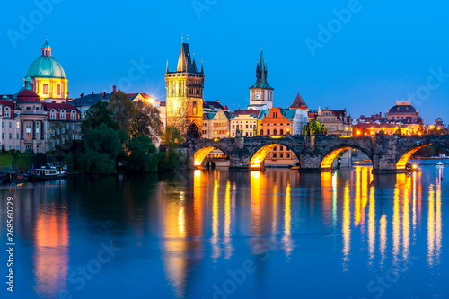 Prague architecture and Charles bridge over Vltava river at night, Czech Republic © Mistervlad