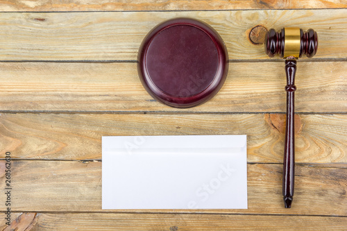 Law concept. Business card. Corporate stationery set mockup. Blank textured brand ID elements on wooden table, gavel. Top view.