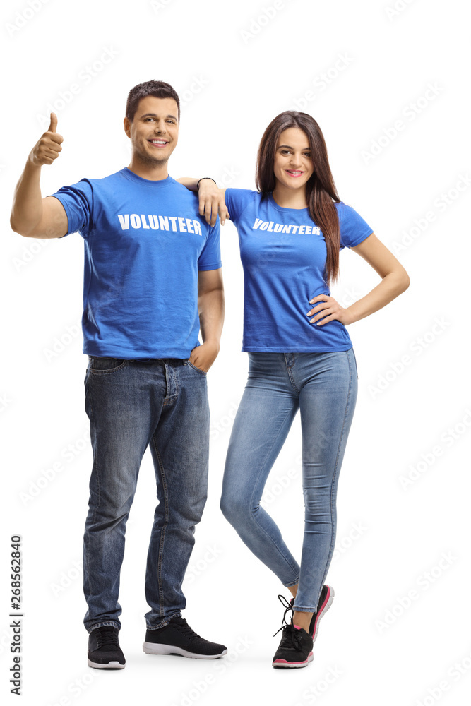 Young volunteers posing and showing thumbs up Young volunteers posing and showing thumbs up