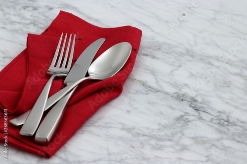 beautiful silverware on fine napkin