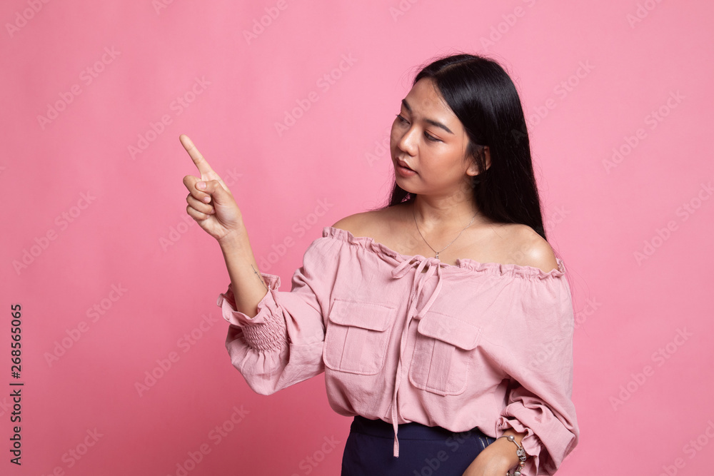 Asian woman touching the screen with finger. Asian woman touching the screen with finger.