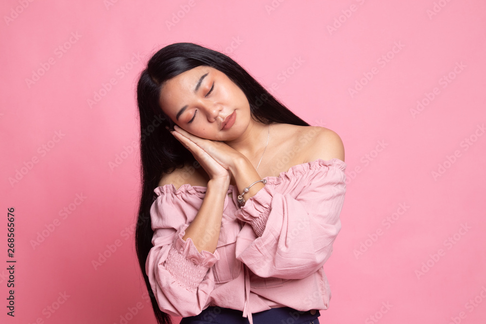 Beautiful young Asian woman with sleeping gesture. Beautiful young Asian woman with sleeping gesture.
