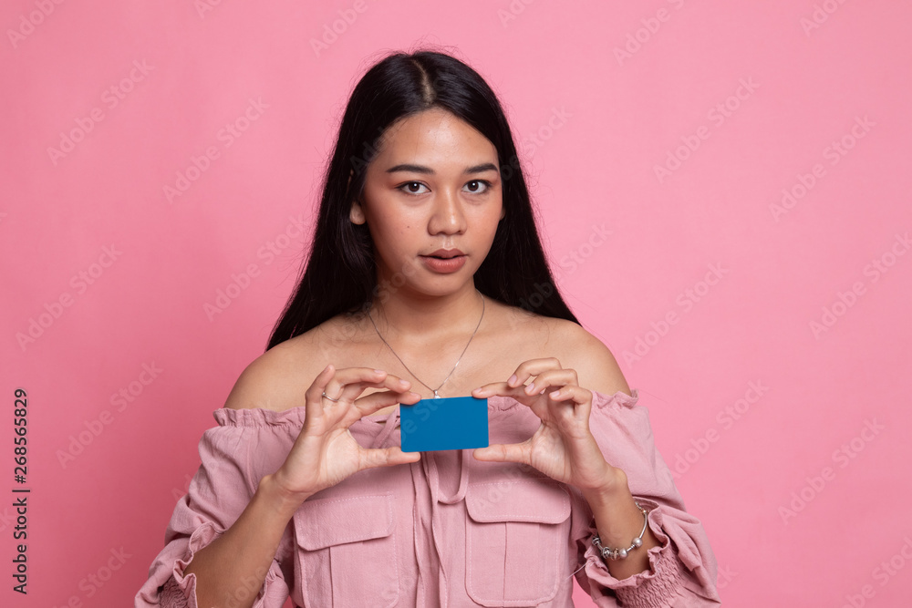 Young Asian woman smile with blank card. Young Asian woman smile with blank card.