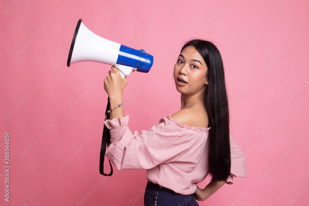 Beautiful young Asian woman announce with megaphone. Beautiful young Asian woman announce with megaphone.