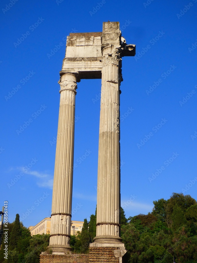 Roman columns with a blue sky background
