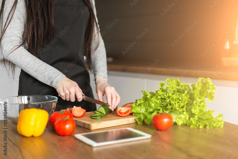 Young trendy woman cooking healthy food in the morning Young trendy woman cooking healthy food in the morning
