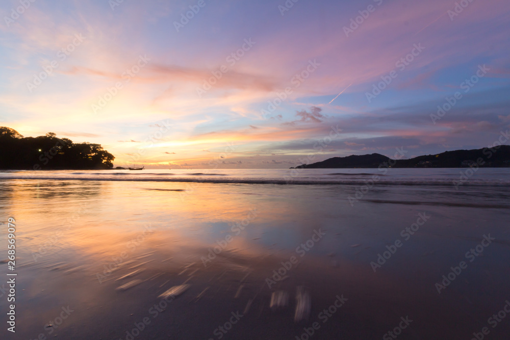 Sunset at Patong beach Thailand motion blur water
