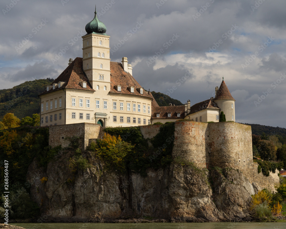 Monastery on a cliff on the shores of the Danube river in Austria