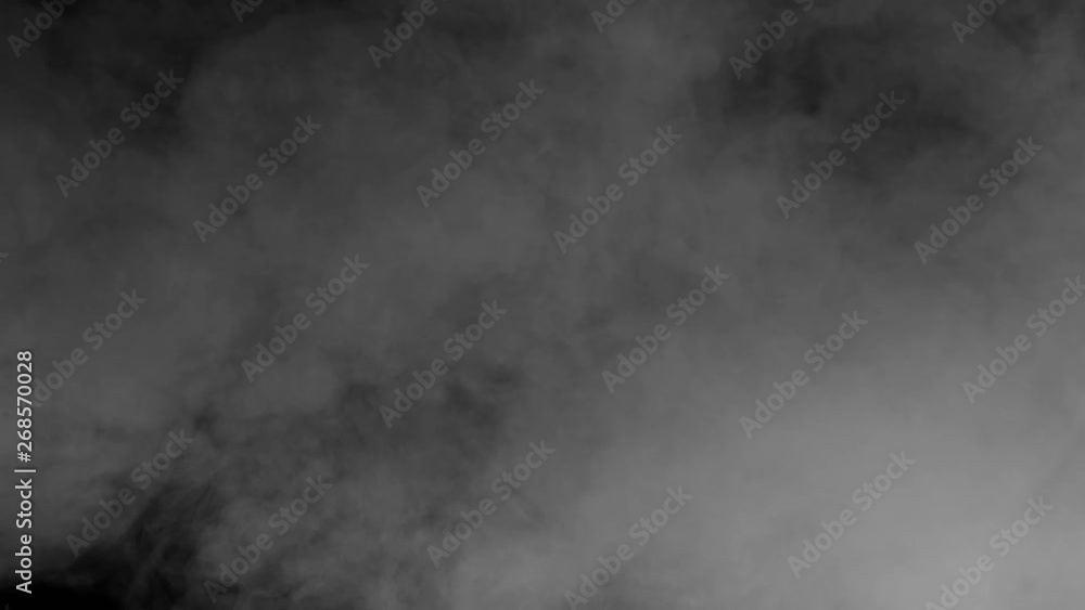 Uneven Smoke Curtain. Gray smoke on a black background slowly dissipates and disappears from the screen Uneven Smoke Curtain. Gray smoke on a black background slowly dissipates and disappears from the screen
