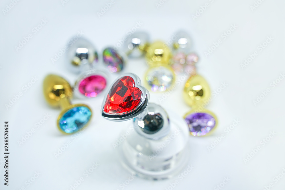 many anal plugs set. sex toys with crystals isolated on white background. many anal plugs set. sex toys with crystals isolated on white background.