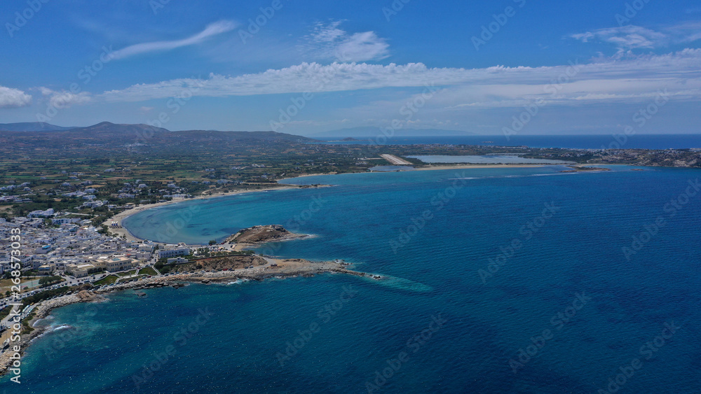 Aerial drone photo of iconic port of Naxos island featuring uphill castle and beautiful Temple of Apollon or Gate, Cyclades, Greece Aerial drone photo of iconic port of Naxos island featuring uphill castle and beautiful Temple of Apollon or Gate, Cyclades, Greece