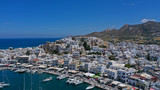 Aerial drone photo of iconic port of Naxos island featuring uphill castle and beautiful Temple of Apollon or Gate, Cyclades, Greece