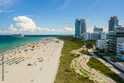 Aerial stock image ship departing Miami inlet and beach scene © Felix Mizioznikov