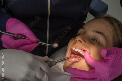 Child girl in specialized dental treatment as routine