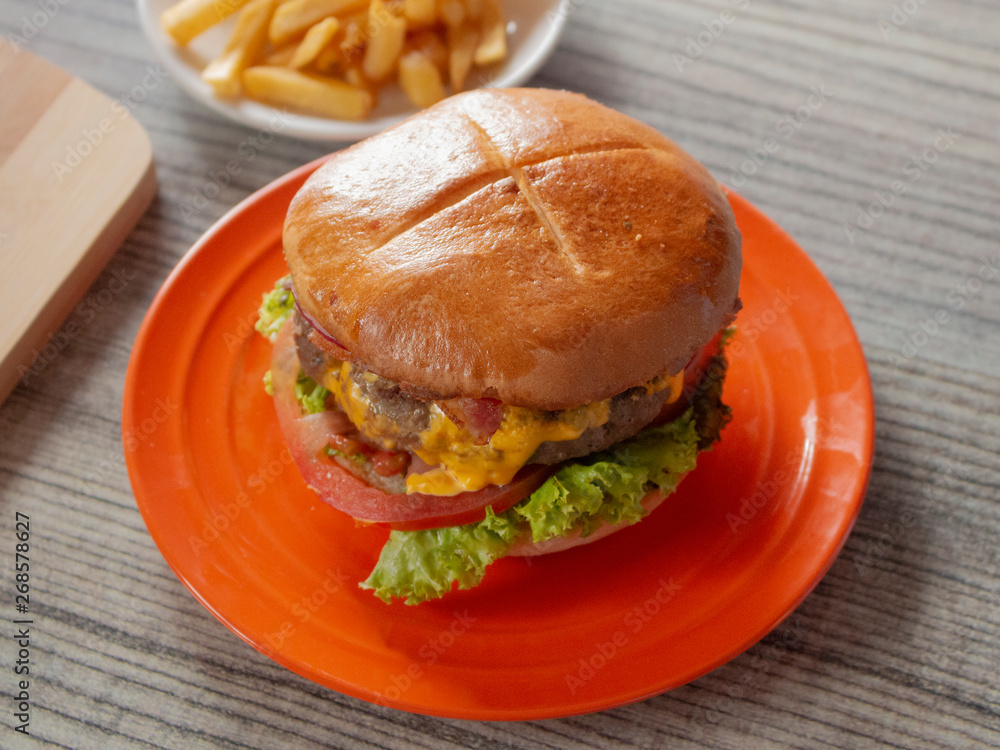 Half Pound Bacon Hamburger and Classic Yellow American Cheese in a